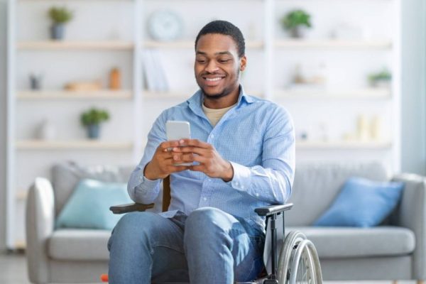 Man-in-wheelchair-using-smartphone-1024x569