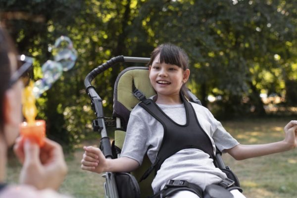 lifestyle-child-wheelchair-scaled-e1701388931280-1536x688
